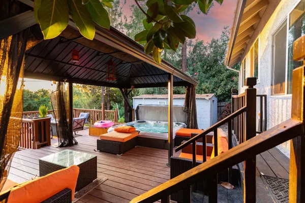 a bathroom with a granite countertop sink a toilet a mirror and vanity