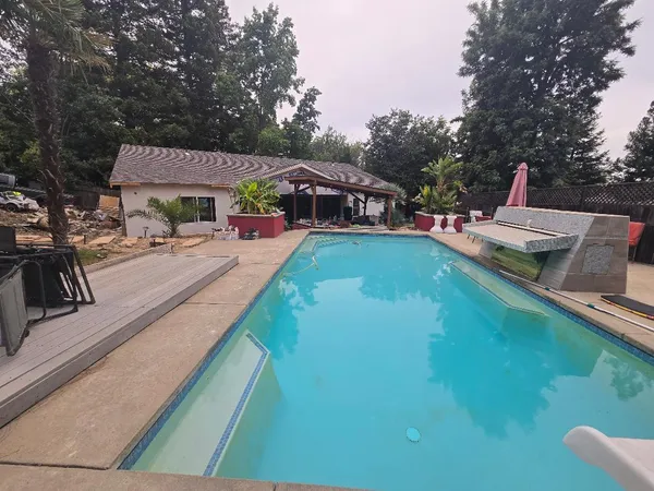 a view of hallway with furniture and a potted plant