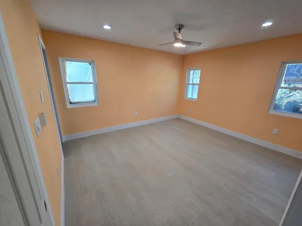 a view of a chairs and fire pit in the yard