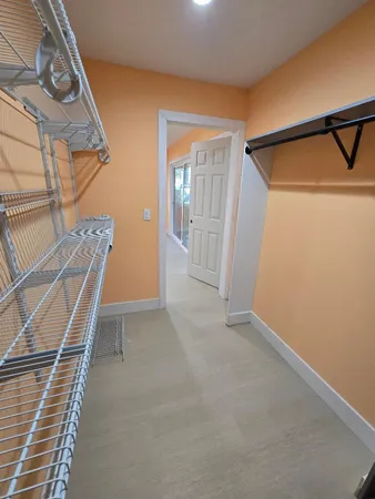 a view of backyard with outdoor seating and plants