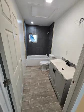 a swimming pool with outdoor seating and yard