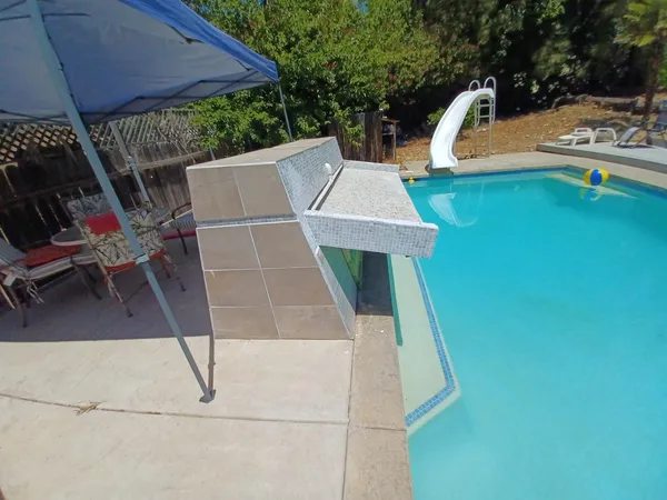 a view of a back yard of the house