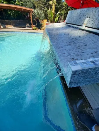 a view of a swimming pool with a patio
