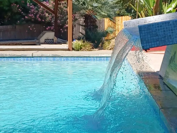 a view of a white house with a yard