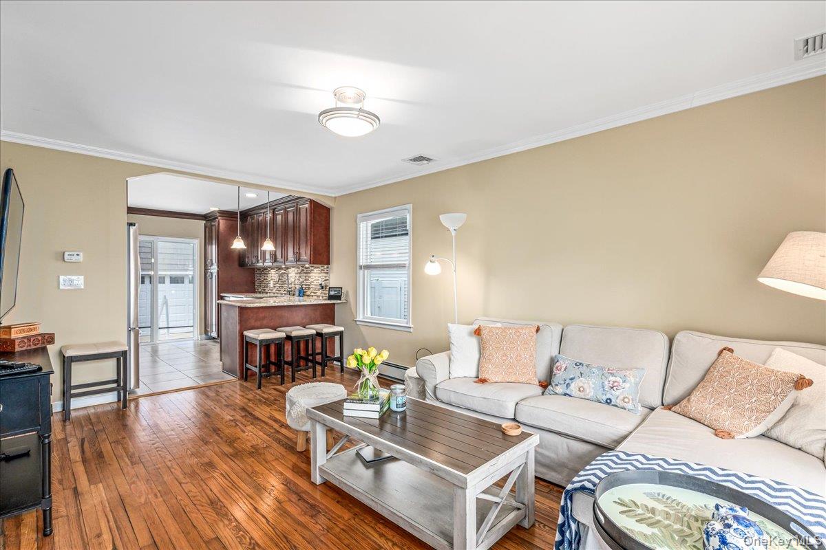 369 Yale Road Garden City, NY 11530 - Photo 4 of 19 Living Room into Kitchen