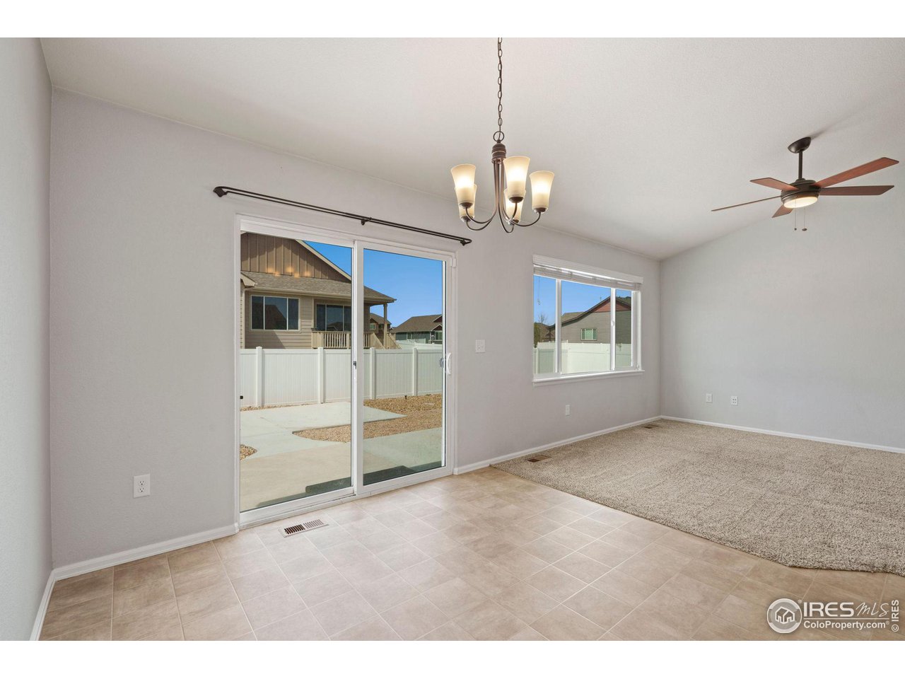 856 Sunlight Peak Drive Severance, CO 80550 - Photo 12 of 40 a view of a livingroom with a chandelier