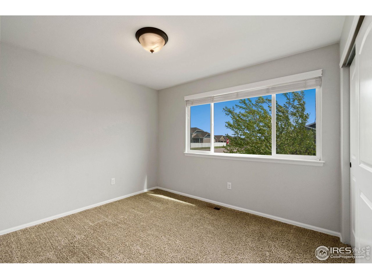 856 Sunlight Peak Drive Severance, CO 80550 - Photo 27 of 40 a view of empty room with window