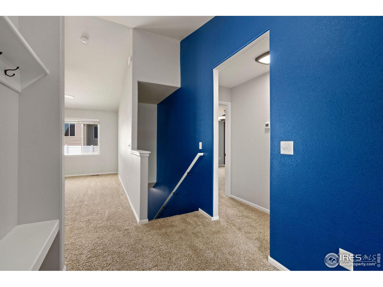 856 Sunlight Peak Drive Severance, CO 80550 - Photo 30 of 40 a view of an empty room with stairs