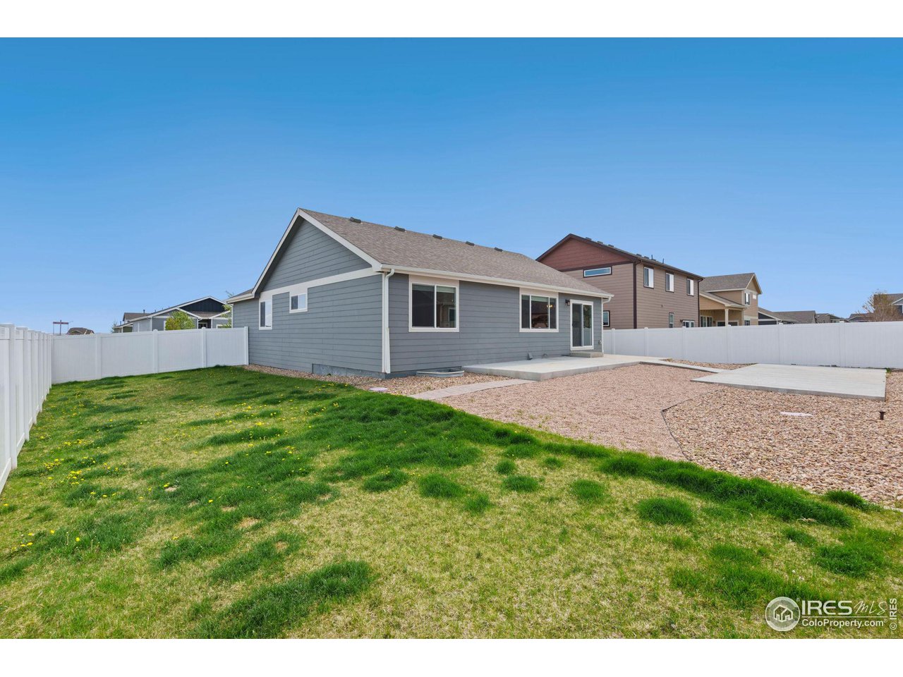 856 Sunlight Peak Drive Severance, CO 80550 - Photo 38 of 40 a front view of a house with a garden