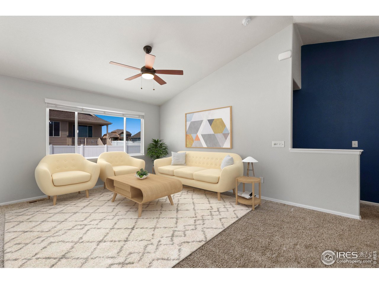856 Sunlight Peak Drive Severance, CO 80550 - Photo 5 of 40 a living room with furniture and a large window