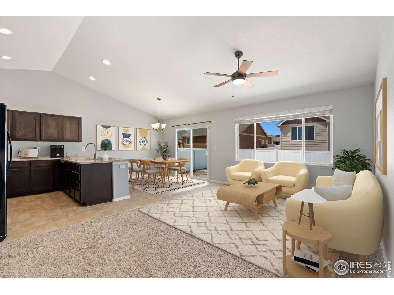 856 Sunlight Peak Drive Severance, CO 80550 - Photo 7 of 40 a living room with furniture kitchen view and a chandelier