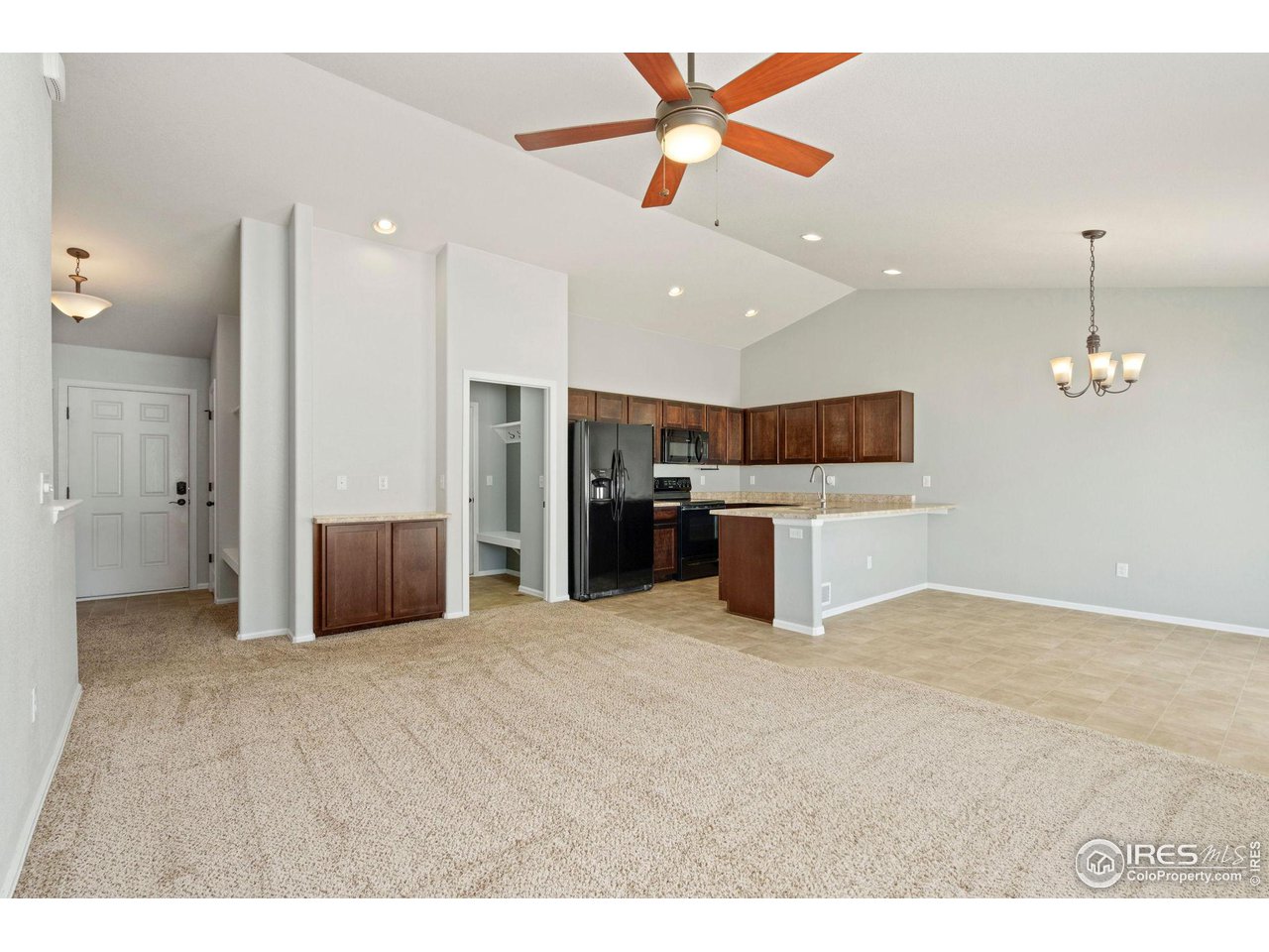856 Sunlight Peak Drive Severance, CO 80550 - Photo 8 of 40 a view of a kitchen with a sink