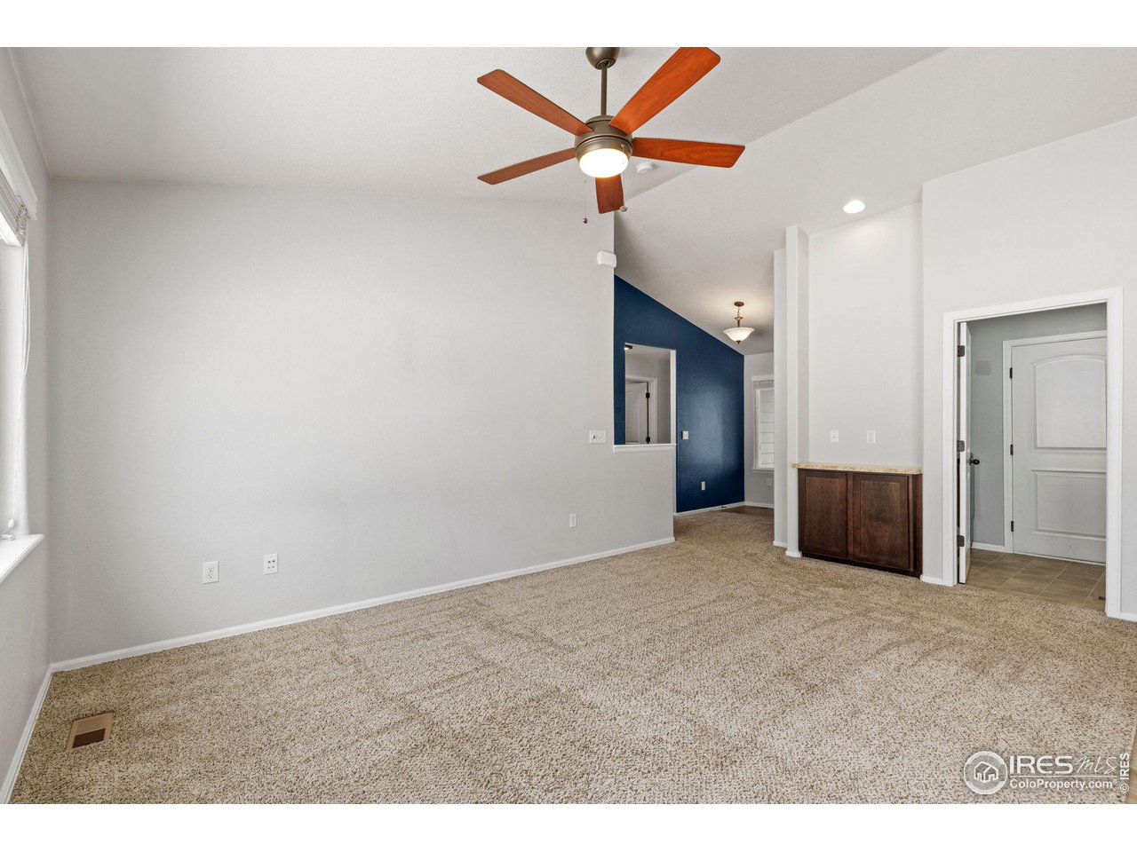 856 Sunlight Peak Drive Severance, CO 80550 - Photo 9 of 40 a view of a livingroom with a ceiling fan and window