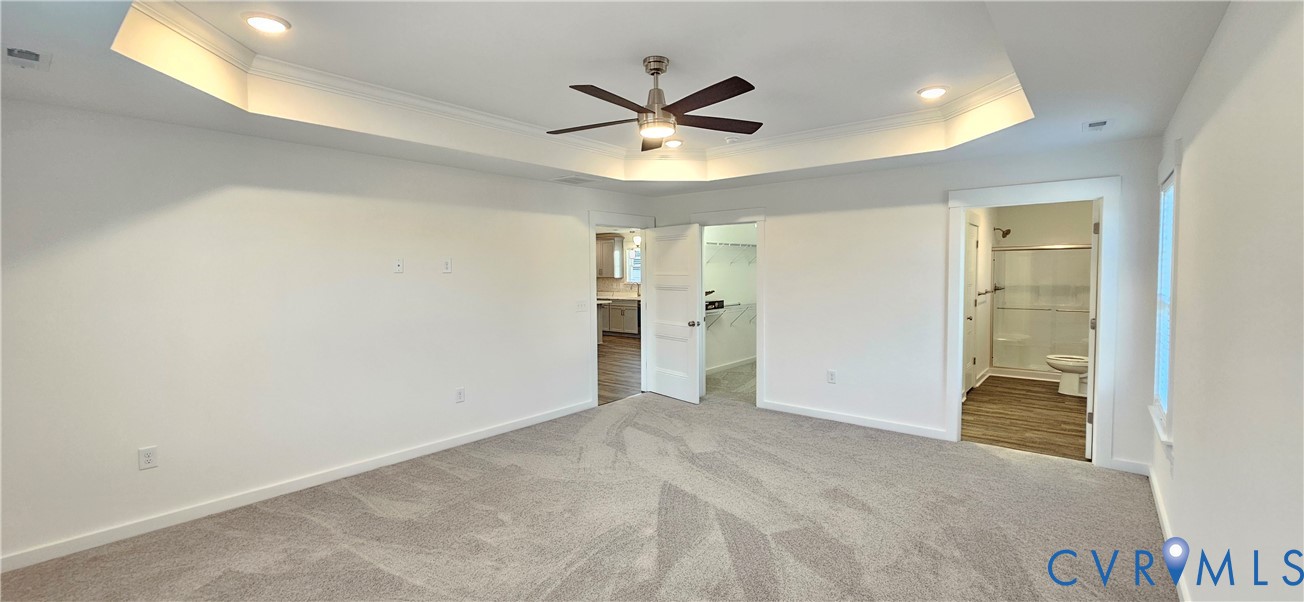 1929 Howerton Road Dunnsville, VA 22454 - Photo 16 of 16 an empty room with closet and ceiling fan
