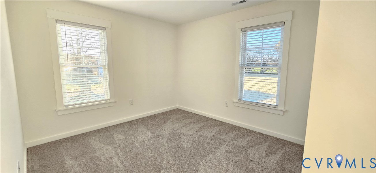 1929 Howerton Road Dunnsville, VA 22454 - Photo 16 of 17 a view of an empty room with a window
