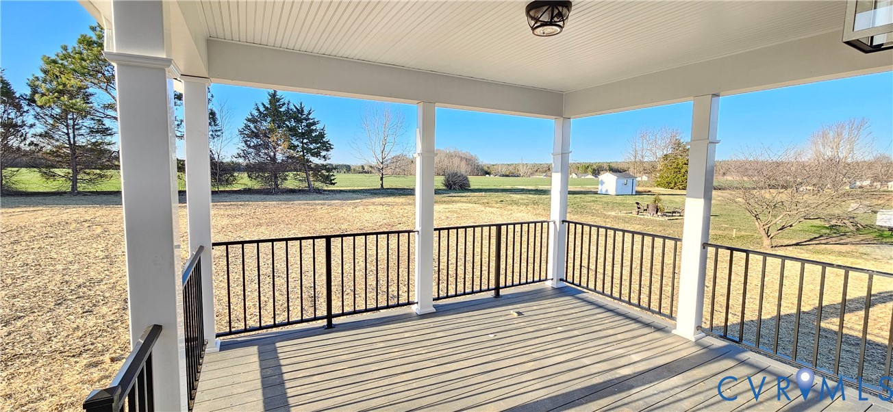 1929 Howerton Road Dunnsville, VA 22454 - Photo 3 of 17 a view of a balcony with wooden floor