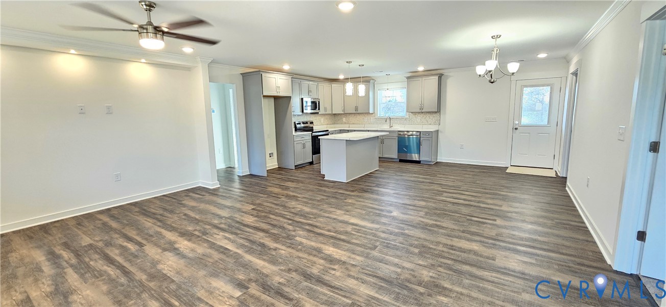 1929 Howerton Road Dunnsville, VA 22454 - Photo 5 of 17 a view of kitchen with wooden floor