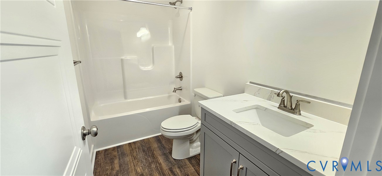 1929 Howerton Road Dunnsville, VA 22454 - Photo 8 of 16 a bathroom with a sink a toilet and shower