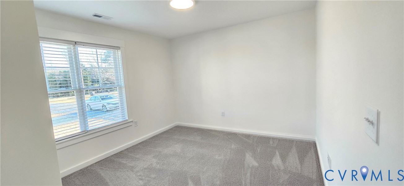 1929 Howerton Road Dunnsville, VA 22454 - Photo 10 of 16 a view of room with window