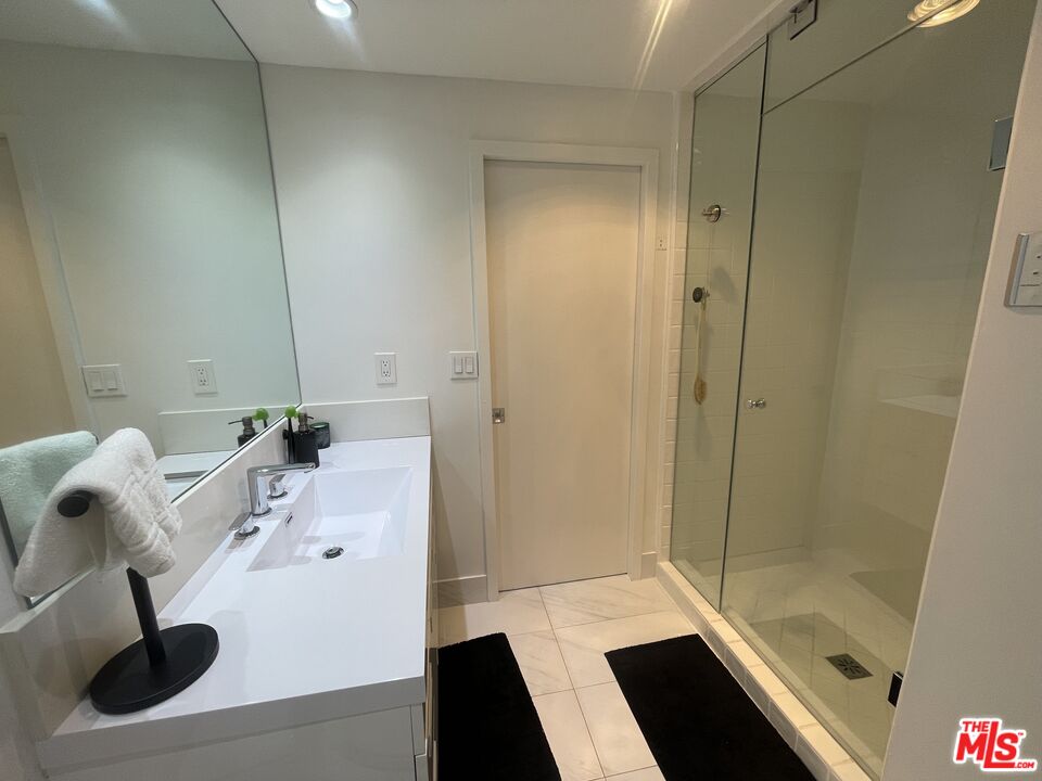 2222 Avenue Of The Stars, Unit 705 Los Angeles, CA 90067 - Photo 14 of 36 a bathroom with a bathtub and shower