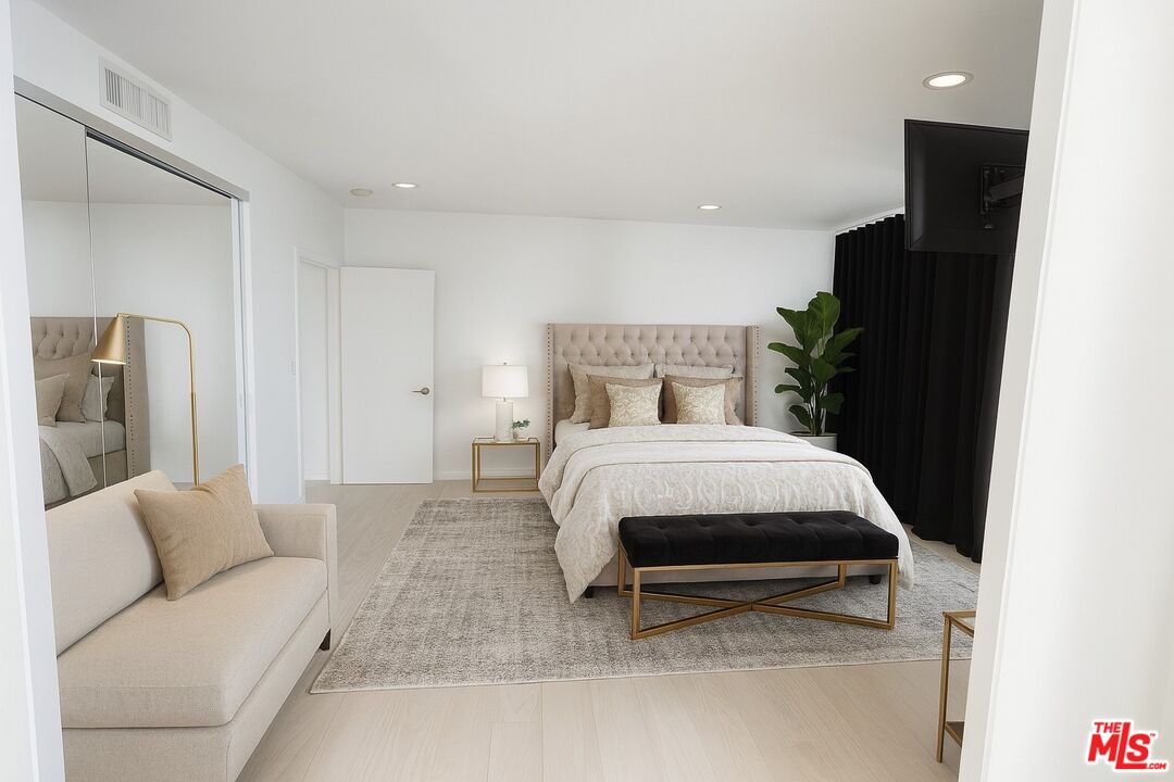 2222 Avenue Of The Stars, Unit 705 Los Angeles, CA 90067 - Photo 18 of 36 a bed room with a bed and a couch