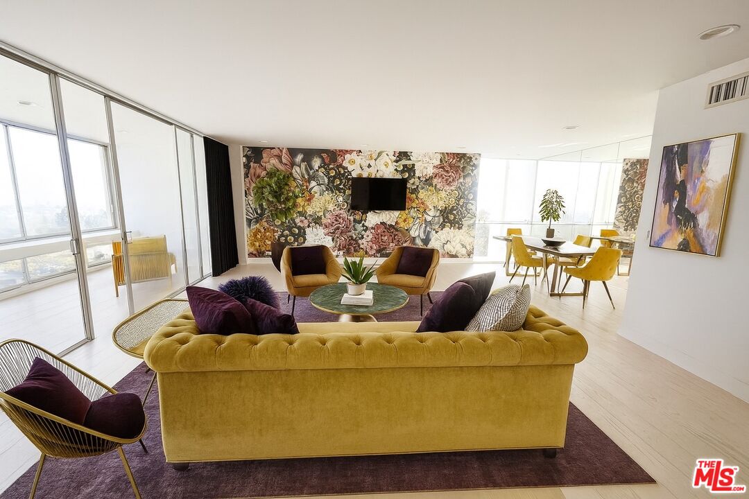 2222 Avenue Of The Stars, Unit 705 Los Angeles, CA 90067 - Photo 7 of 36 a living room with furniture and a large window