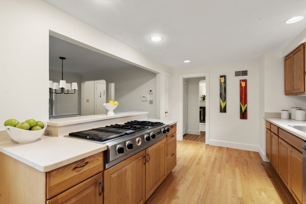 163 Day Street Newton, MA 02466 - Photo 8 of 20 a kitchen that has a lot of cabinets stainless steel appliances and wooden floor