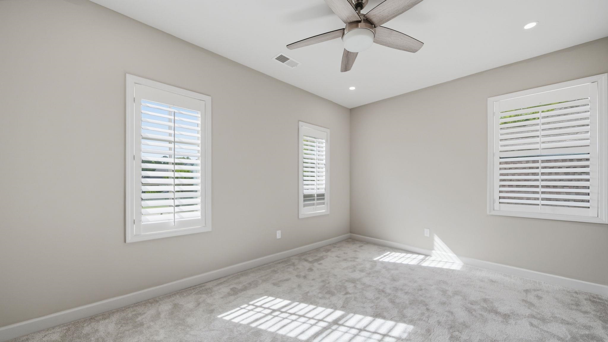 1058 Shanborne Cove Collierville, TN 38017 - Photo 29 of 39 Unfurnished room with carpet flooring, healthy amount of natural light, ceiling fan, and recessed lighting