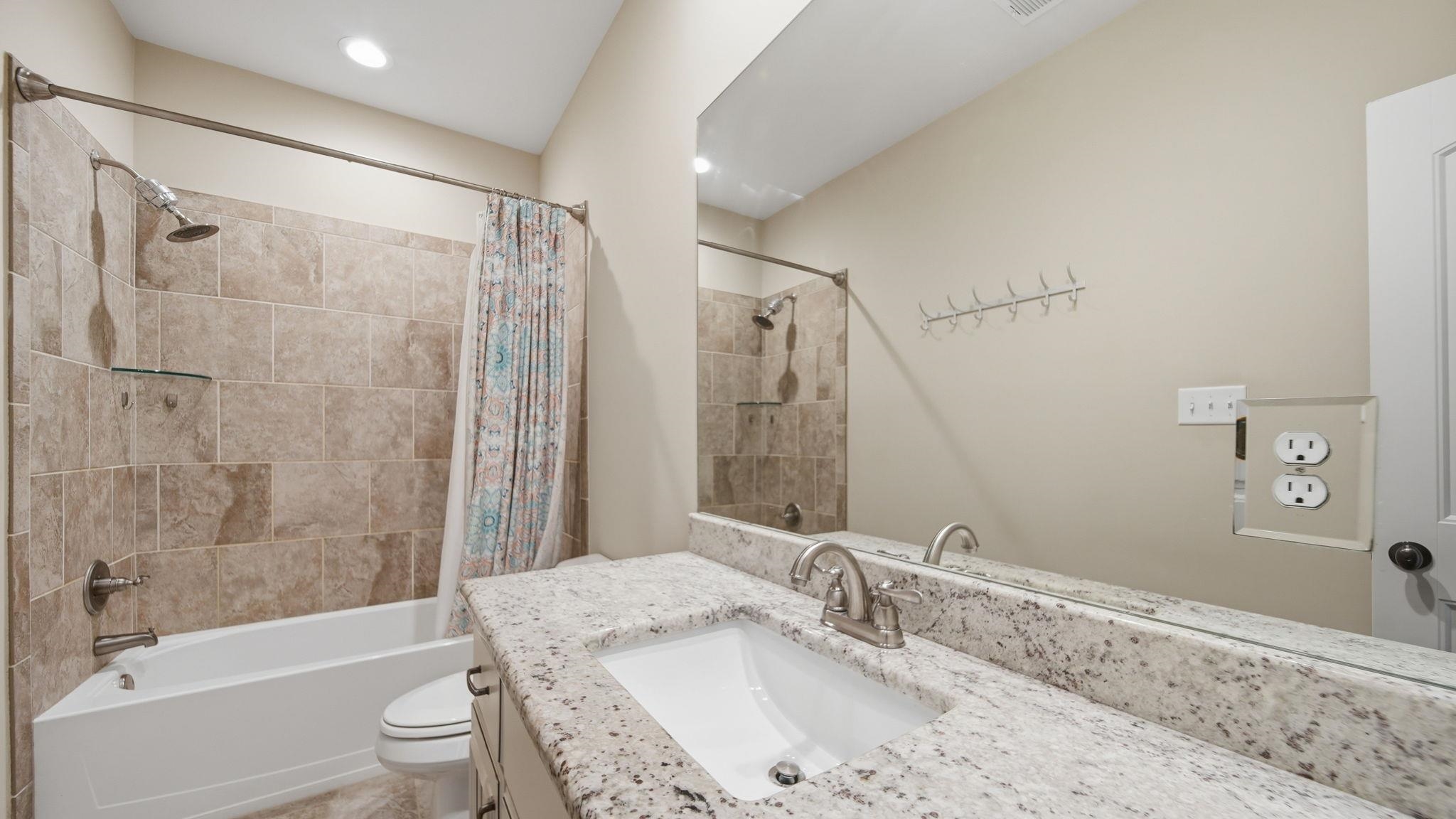 1058 Shanborne Cove Collierville, TN 38017 - Photo 30 of 39 Full bath with vanity and shower / bath combo with shower curtain