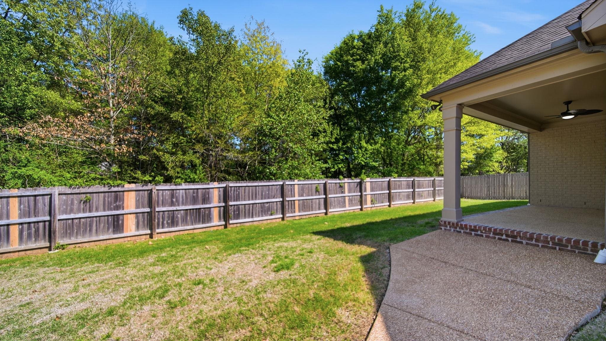 1058 Shanborne Cove Collierville, TN 38017 - Photo 36 of 39 Fenced backyard featuring a patio area and ceiling fan
