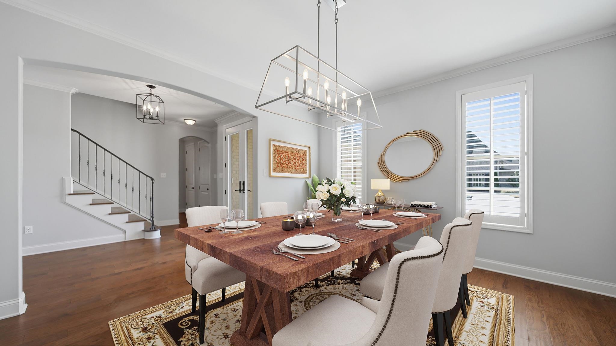 1058 Shanborne Cove Collierville, TN 38017 - Photo 8 of 39 Dining area with arched walkways, crown molding, dark wood-style floors, and a chandelier