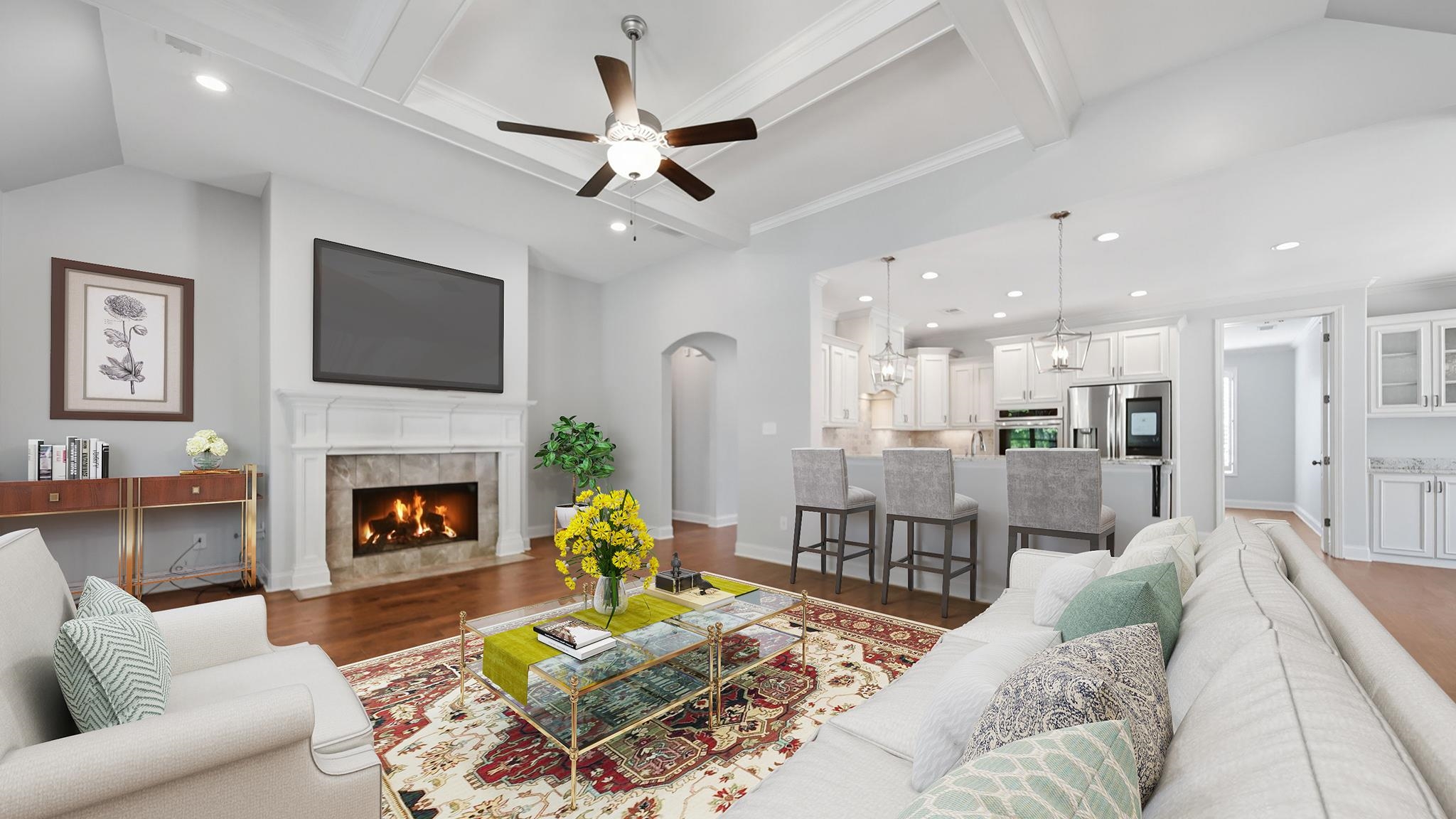 1058 Shanborne Cove Collierville, TN 38017 - Photo 10 of 39 Living room featuring lofted ceiling with beams, recessed lighting, a ceiling fan, dark wood-style flooring, and a tile fireplace