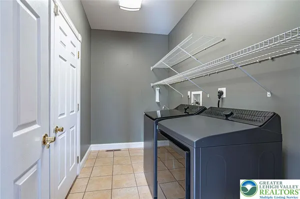 a view of a hallway with wooden floor and stairs