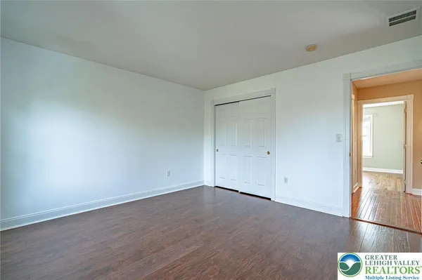 a view of a balcony with wooden floor