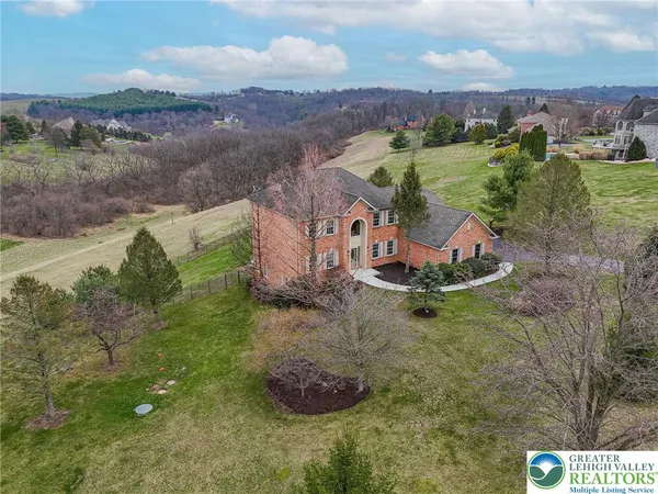 an aerial view of a house with a garden