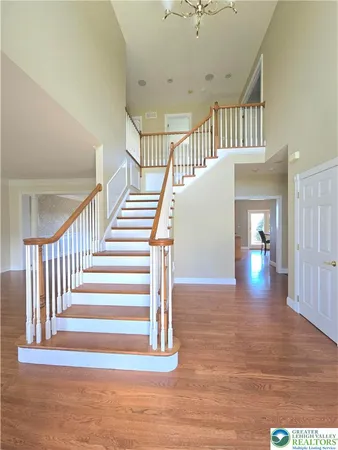 a view of an entryway with wooden floor