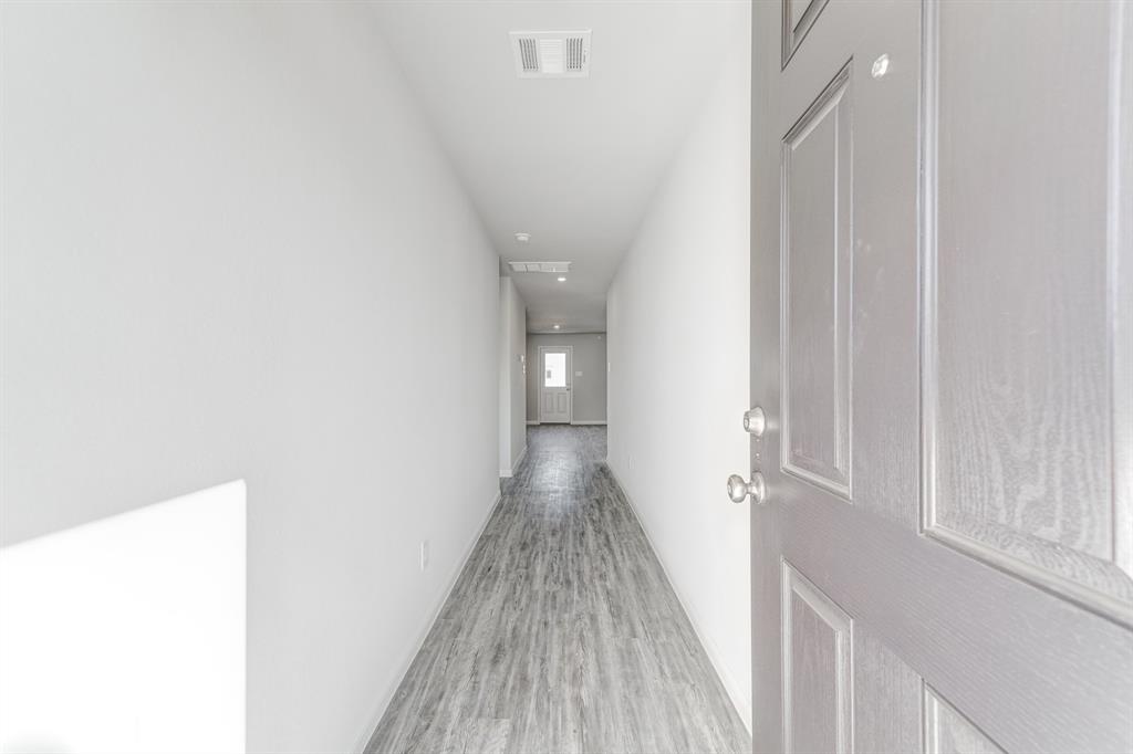 3542 Silver Springs Abilene, TX 79602 - Photo 9 of 16 a view of a hallway with wooden floor