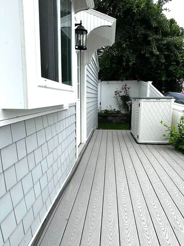 a view of a balcony with furniture