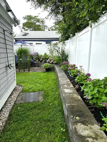 a view of a backyard with garden