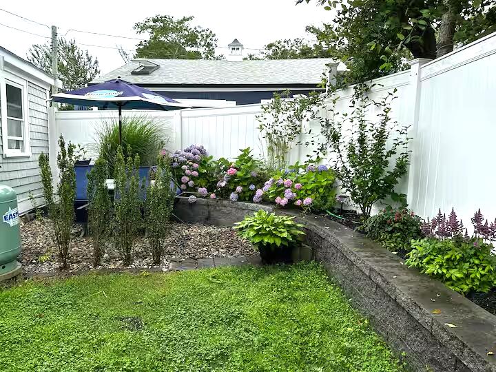 230 Old Wharf Road, Unit 272 Dennis Port, MA 02639 - Photo 4 of 17 a view of a backyard with plants