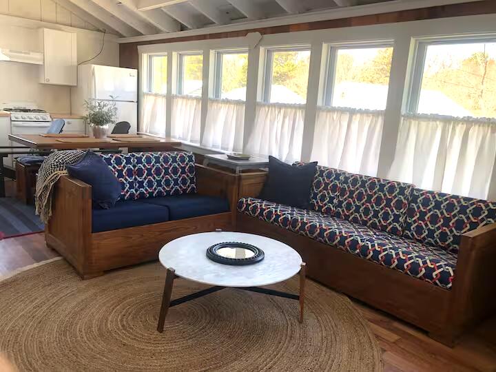 230 Old Wharf Road, Unit 272 Dennis Port, MA 02639 - Photo 8 of 17 a living room with furniture and a large window