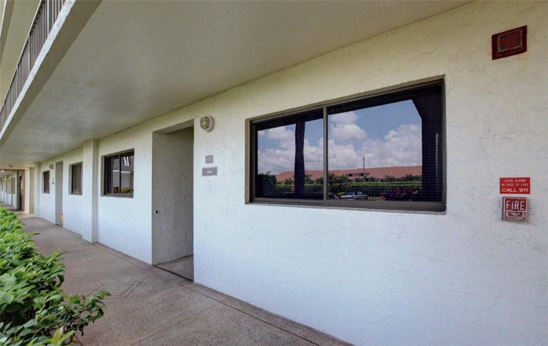 5574 Witney Drive, Unit 109 Delray Beach, FL 33484 - Photo 4 of 21 WITNEY BUILDING CORRIDOR