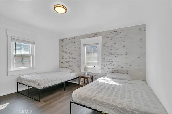 a bedroom with a bed and a table