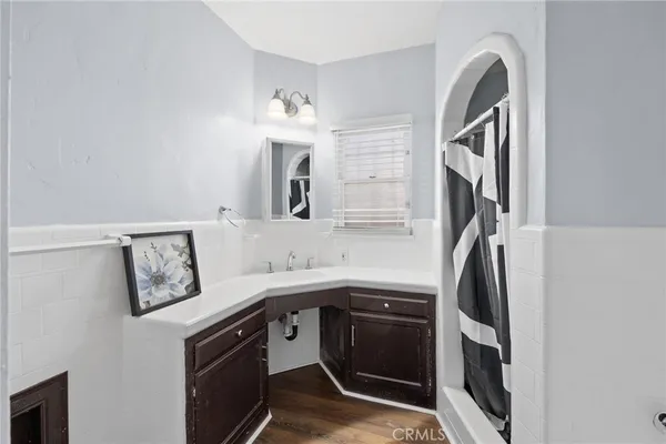a kitchen with stainless steel appliances granite countertop a sink and a refrigerator
