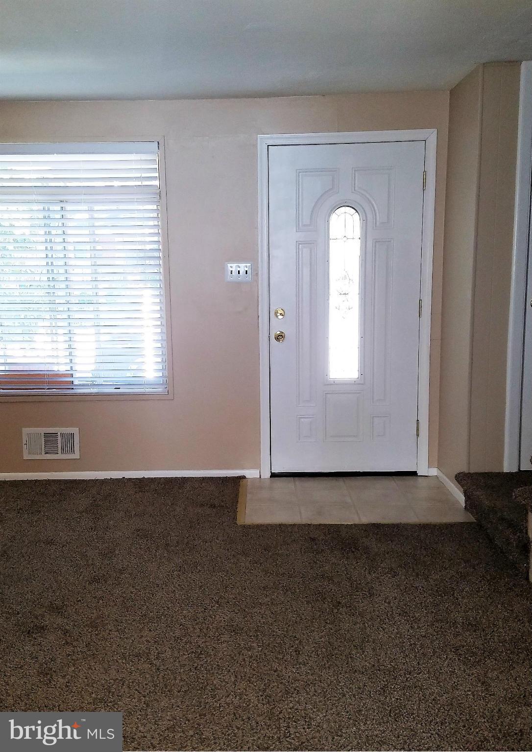 952 Bayner Road Essex, MD 21221 - Photo 2 of 17 an empty room that has a window
