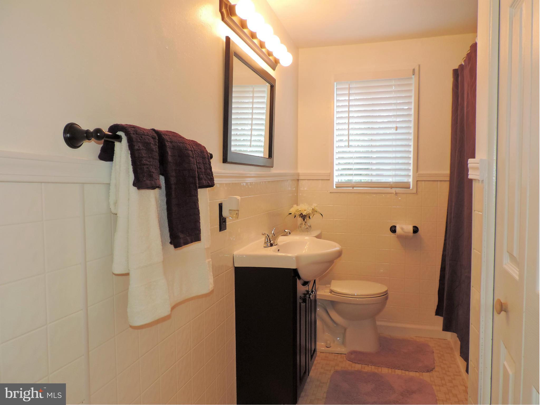 952 Bayner Road Essex, MD 21221 - Photo 13 of 17 a bathroom with a sink toilet and shower