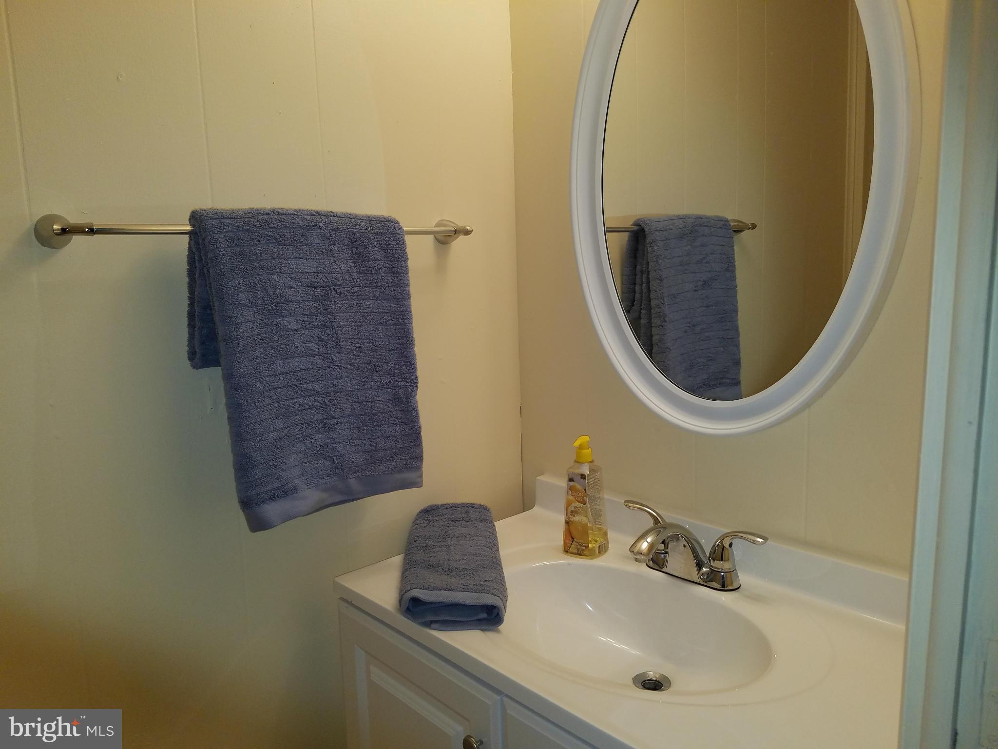 952 Bayner Road Essex, MD 21221 - Photo 14 of 17 a bathroom with a sink and a mirror