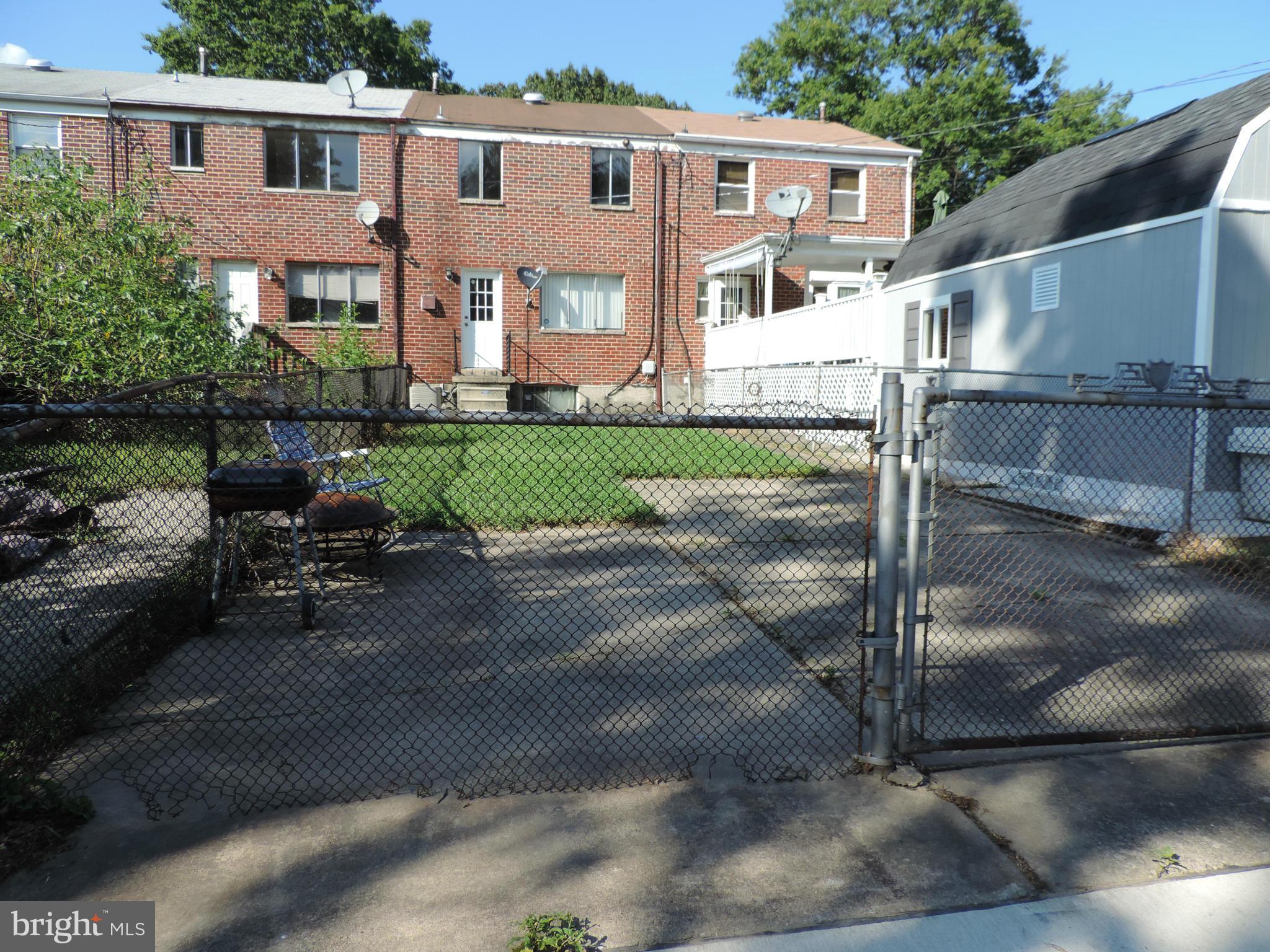 952 Bayner Road Essex, MD 21221 - Photo 17 of 17 a front view of a house with a garden
