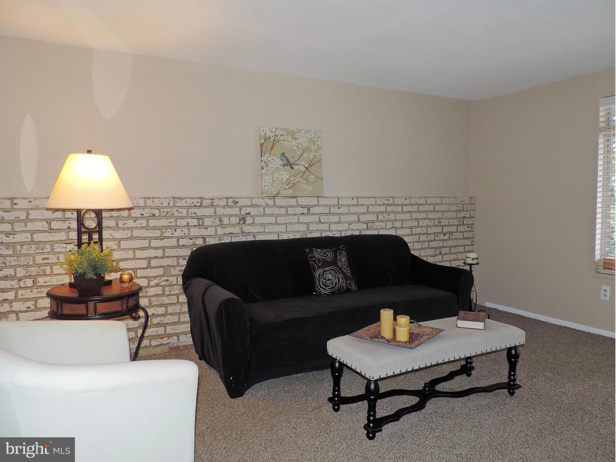 952 Bayner Road Essex, MD 21221 - Photo 4 of 17 a living room with furniture and a lamp