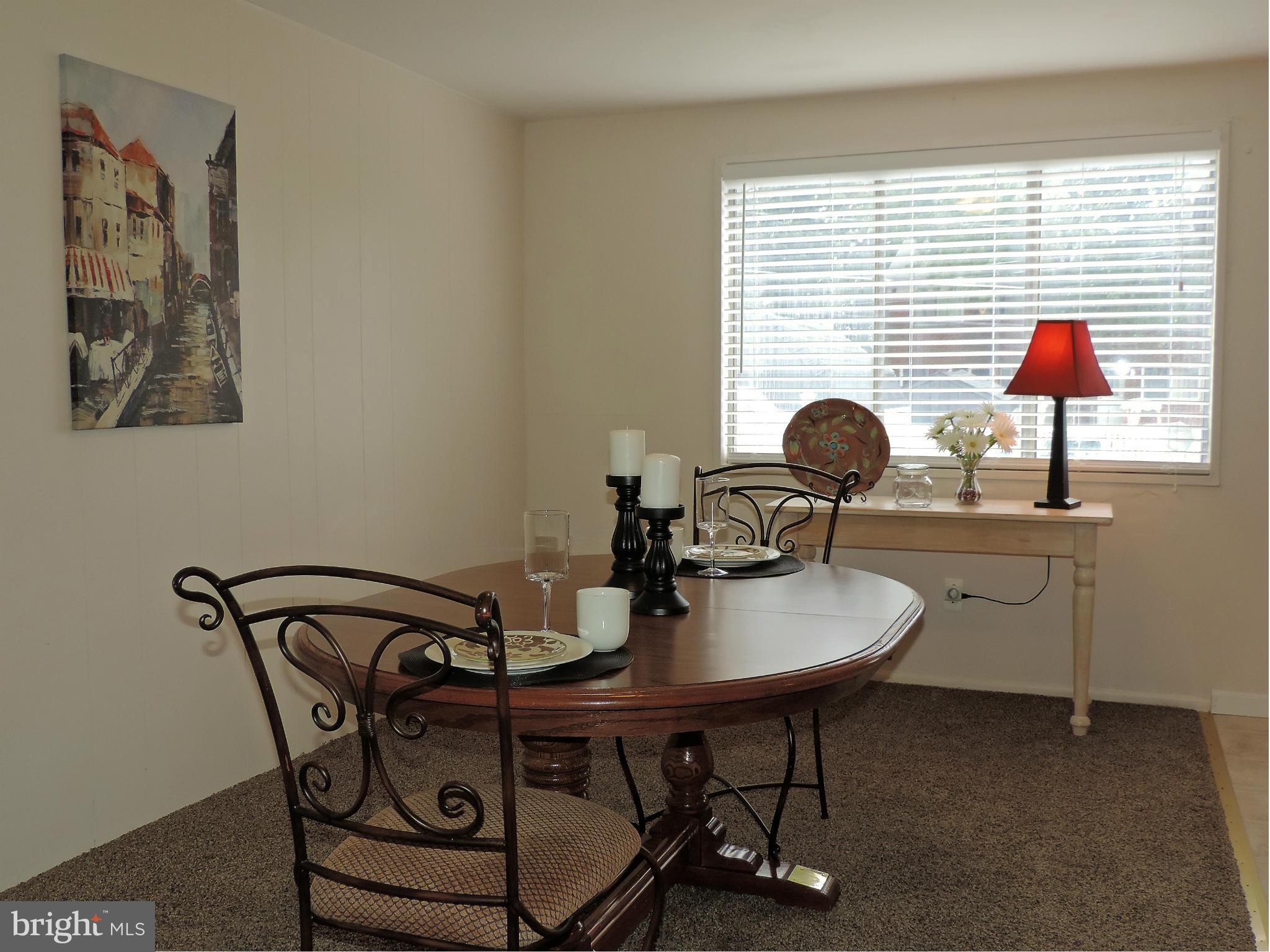 952 Bayner Road Essex, MD 21221 - Photo 5 of 17 a view of a dining room with furniture and window